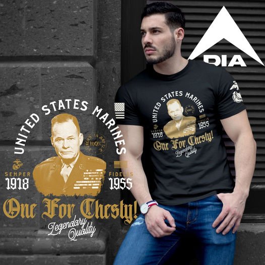 Man leaning on a stone wall, wearing a black USMC "One For Chesty" t-shirt with a gold Chesty Puller portrait.