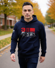 Man wearing navy hoodie featuring a firefighter truck graphic and American flag design