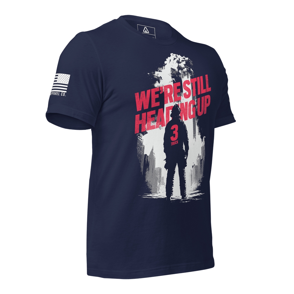 Navy t-shirt, three-quarter view angled right, firefighter graphic, American flag right sleeve, 3 Truck crest left sleeve.