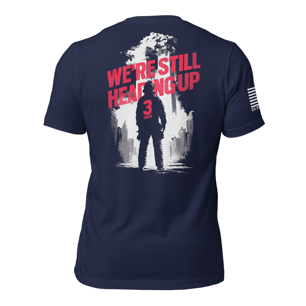 Navy t-shirt back view, featuring a firefighter "We're Still Heading Up" graphic, American flag on the right sleeve.