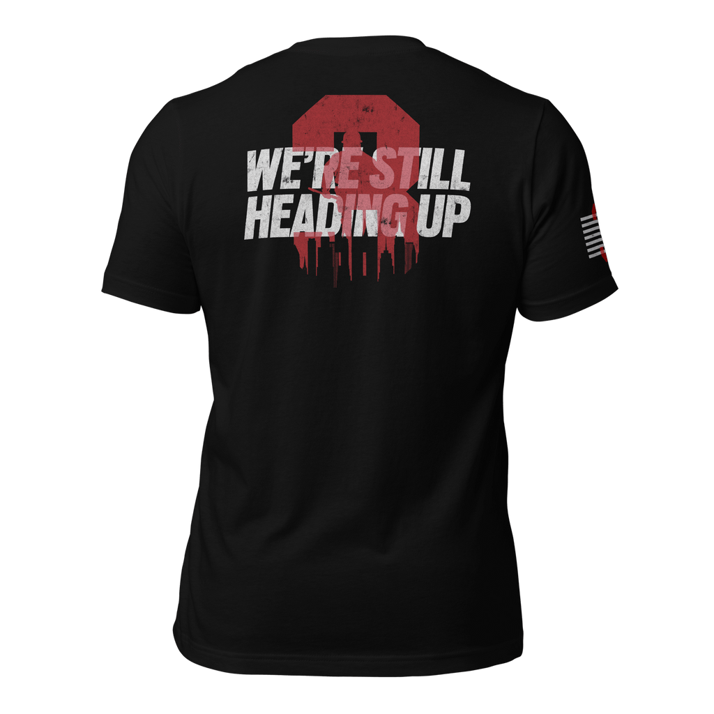Black 3 Truck T-shirt back featuring large “We’re Still Heading Up” firefighter emblem and memorial text