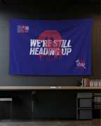 Modern office blue Truck 3 memorial flag with a red number 3, skyline, and firefighting tools on a dark wall.