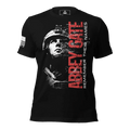 Black t-shirt featuring a front graphic with the text "ABBEY GATE," a soldier silhouette, and the American flag on the sleeve.