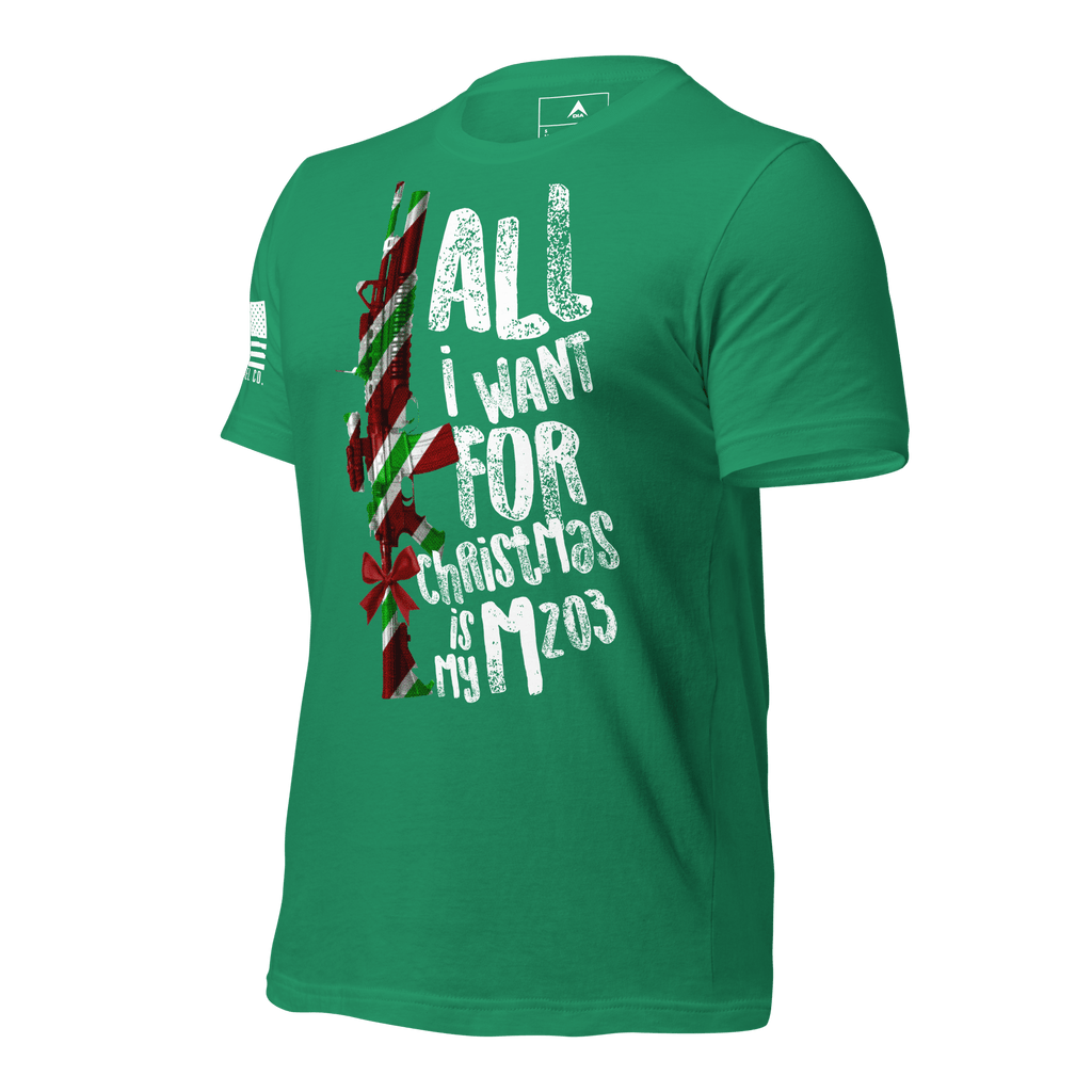 Kelly green t-shirt angled right featuring a festive M203 rifle graphic and a white American flag on the sleeve.