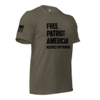 Army green t-shirt angled left, with "FREE PATRIOT AMERICAN" text and a black American flag on the right sleeve.