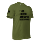 Olive green t-shirt angled left, with "FREE PATRIOT AMERICAN" text and a black American flag on the right sleeve.