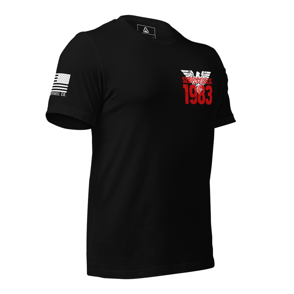 Black t-shirt in a three-quarter view, featuring a red "1983" graphic and an American flag on the sleeve.