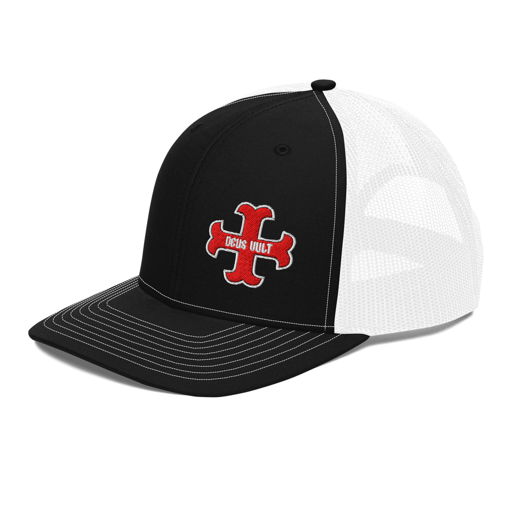 Black trucker hat from a three-quarter view with a red "DEUS VULT" cross logo and white mesh back.