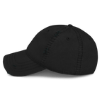 Black distressed cap, shown from a left-side view, featuring visible stitching and distressing on the crown and brim.