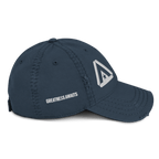 Navy blue distressed cap, right-side view, featuring "GREATNESS AWAITS" text and a white DIA logo on the front.