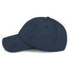 Navy blue distressed cap, shown from a left-side view, featuring visible stitching and distressing on the crown and brim.