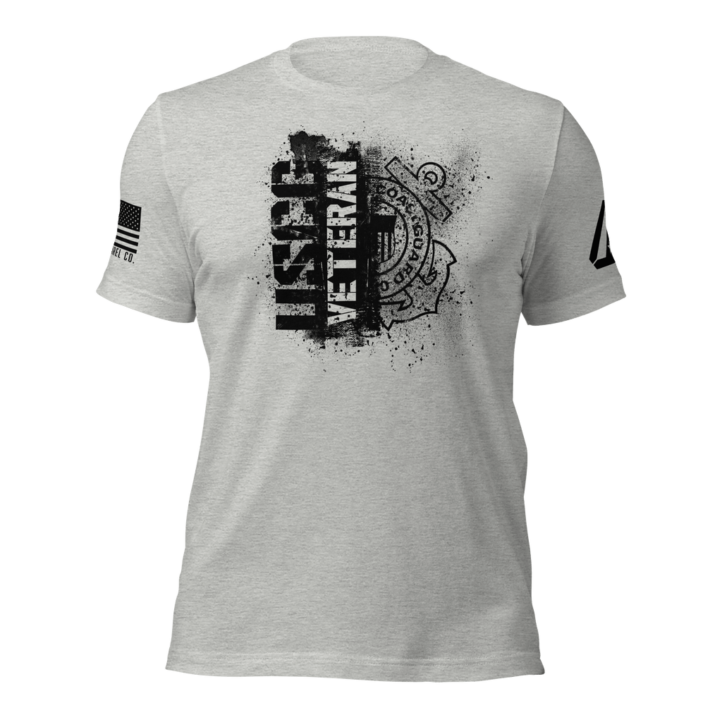 Athletic heather t-shirt featuring a black "USCG VETERAN" chest graphic, an American flag, and a DIA logo on the sleeves.