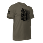 Army green t-shirt, angled left, featuring a black "USCG VETERAN" chest graphic and an American flag on the sleeve.