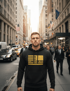 Man in a busy city wearing black hoodie with a yellow American flag and "DON'T TREAD ON ME" text.