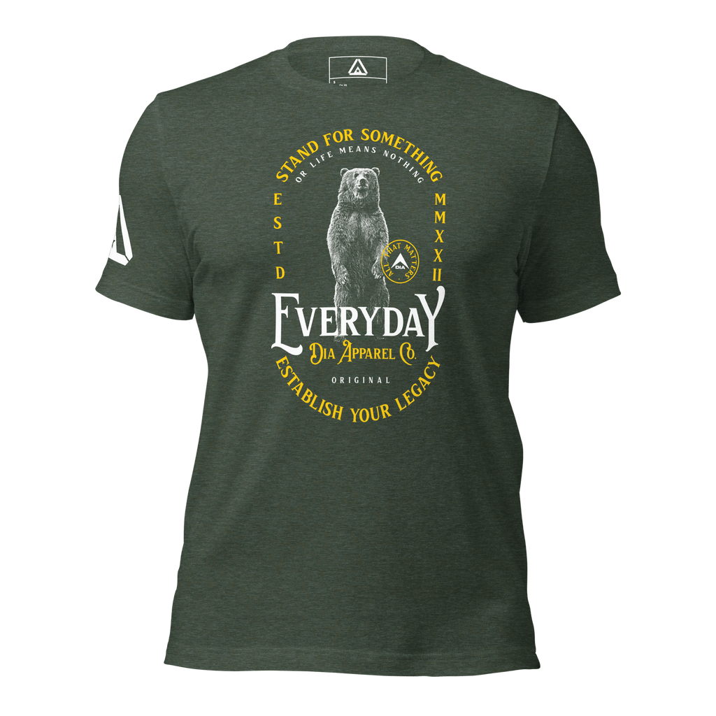 green t-shirt, front view, featuring a standing bear graphic, the text "STAND FOR SOMETHING," and a DIA logo.