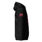 Black hoodie shown from a right-side view, featuring a red American flag patch with "DIA APPAREL CO." on the sleeve.