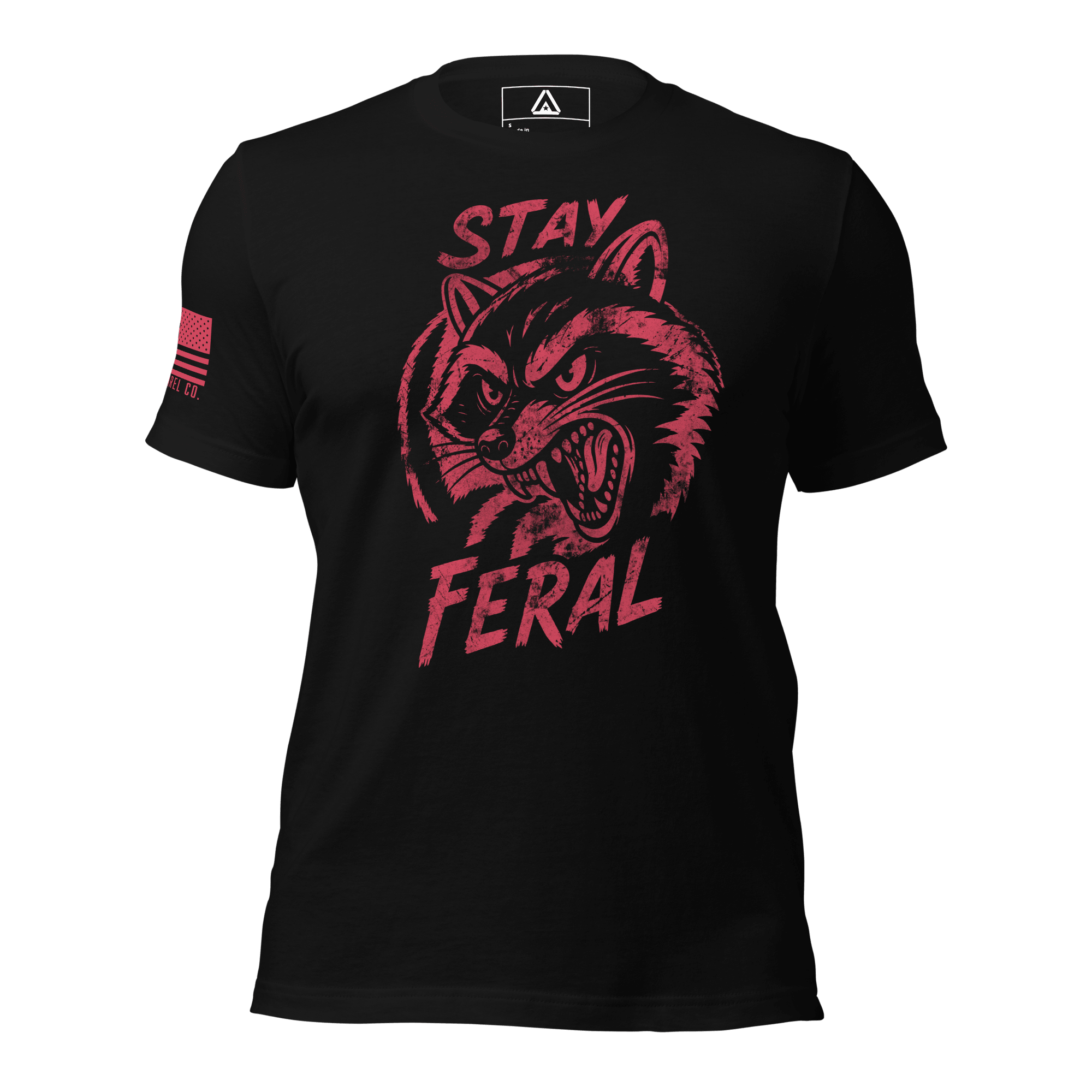 Black t-shirt with distressed red "Stay Feral" snarling raccoon graphic and an American flag patch on right sleeve.