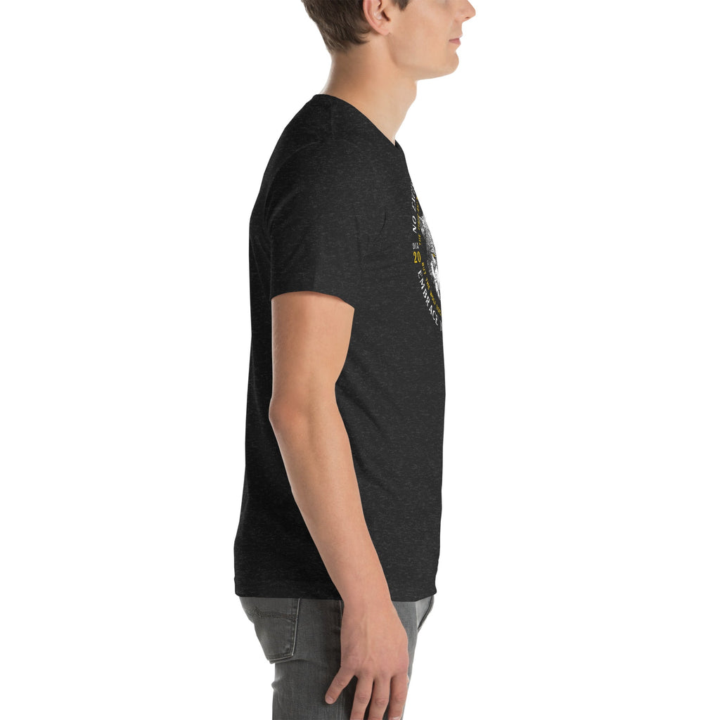 Right-side profile view of a man wearing a black heather wolf graphic t-shirt.