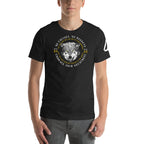 A man wearing a black heather wolf graphic t-shirt featuring "No Excuses. No Regrets" and "Embrace Your Greatness" text.