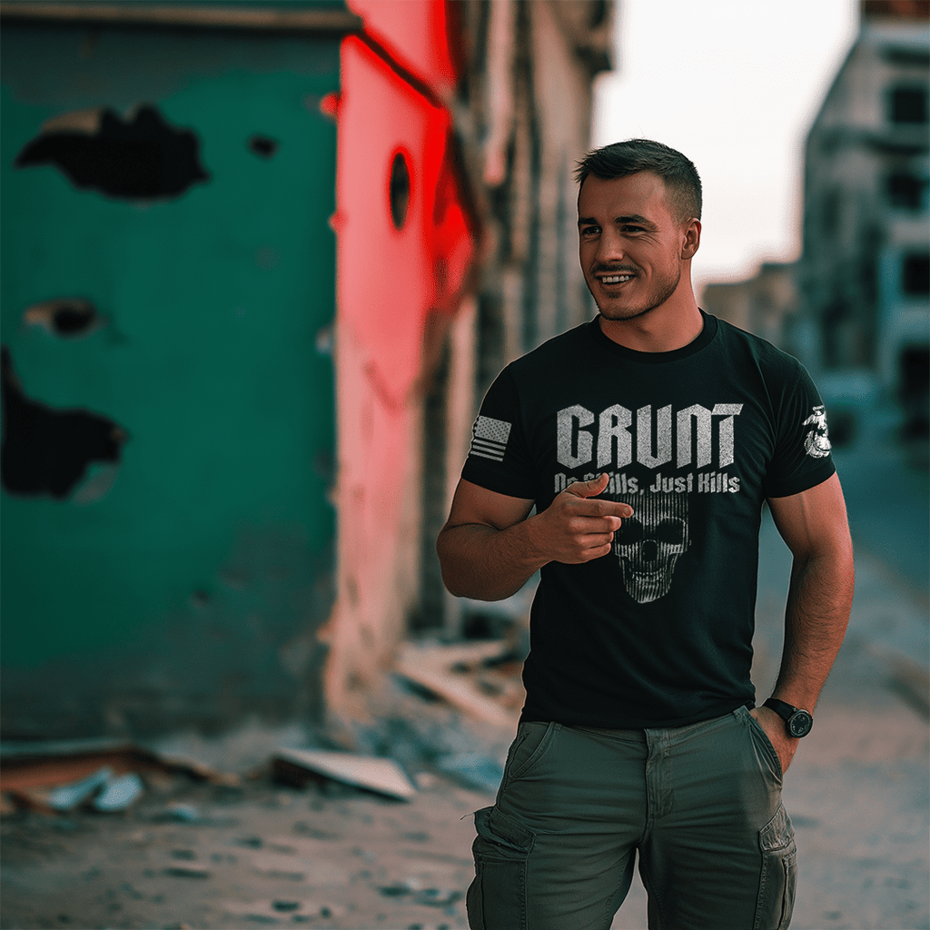 Man standing in an urban setting wearing a black "GRUNT" t-shirt with a skull and "No Skills, Just Kills" graphic.