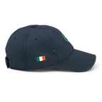 Navy blue distressed cap, shown from a right-side view, featuring an Irish flag and a green shamrock on the front.