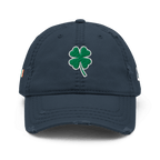 Navy blue distressed trucker cap, front view, featuring a green shamrock and a DIA logo on the side.