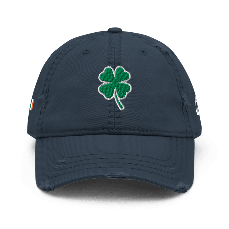 Navy blue distressed trucker cap, front view, featuring a green shamrock and a DIA logo on the side.