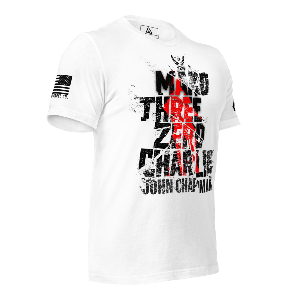 White t-shirt angled right, featuring distressed "Mako Three Zero Charlie John Chapman" text with American flag sleeve patch.