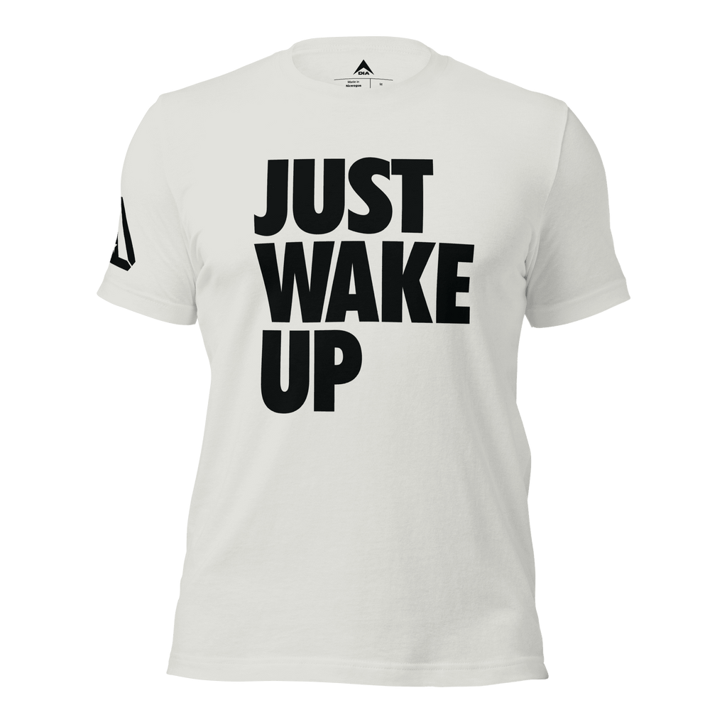 Silver t-shirt, front view, featuring the text "JUST WAKE UP" in a bold black font and a DIA logo.