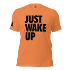 Orange t-shirt, front view, featuring the text "JUST WAKE UP" in a bold black font and a DIA logo.