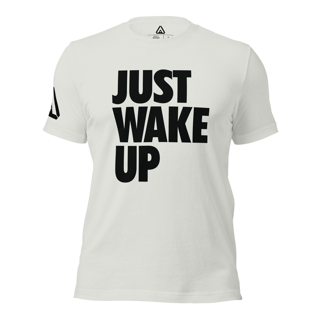 White t-shirt, front view, featuring the text "JUST WAKE UP" in a bold black font and a DIA logo.