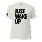 White t-shirt, front view, featuring the text "JUST WAKE UP" in a bold black font and a DIA logo.