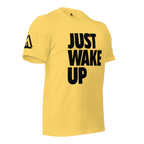 Yellow t-shirt, three-quarter view angled to the left, featuring "JUST WAKE UP" text and a DIA logo.