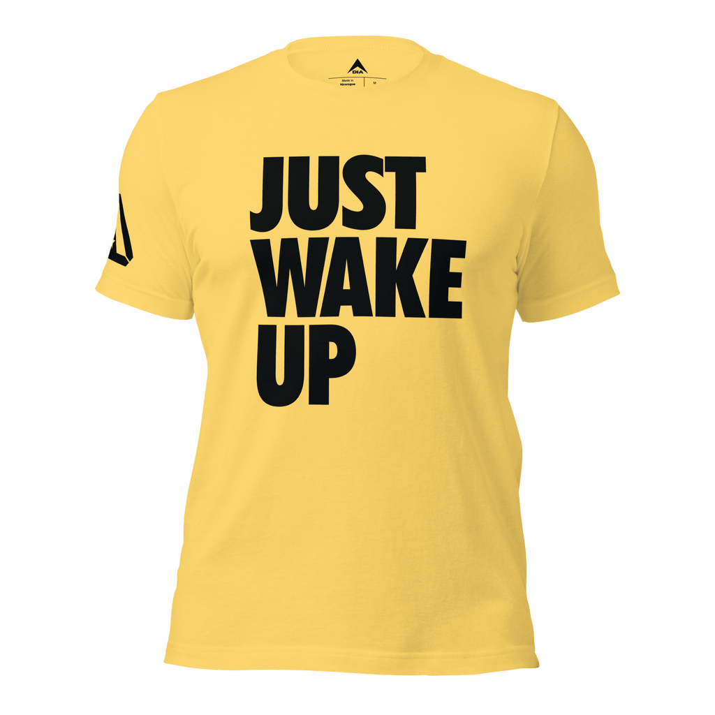 Yellow t-shirt, front view, featuring the text "JUST WAKE UP" in a bold black font and a DIA logo.
