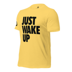 Yellow t-shirt, three-quarter view angled to the right, featuring the text "JUST WAKE UP"