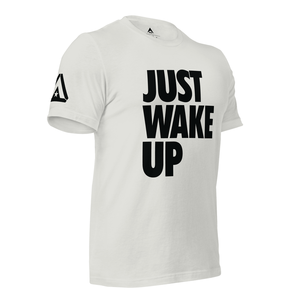 Silver t-shirt, three-quarter view angled to the left, featuring "JUST WAKE UP" text and a DIA logo.