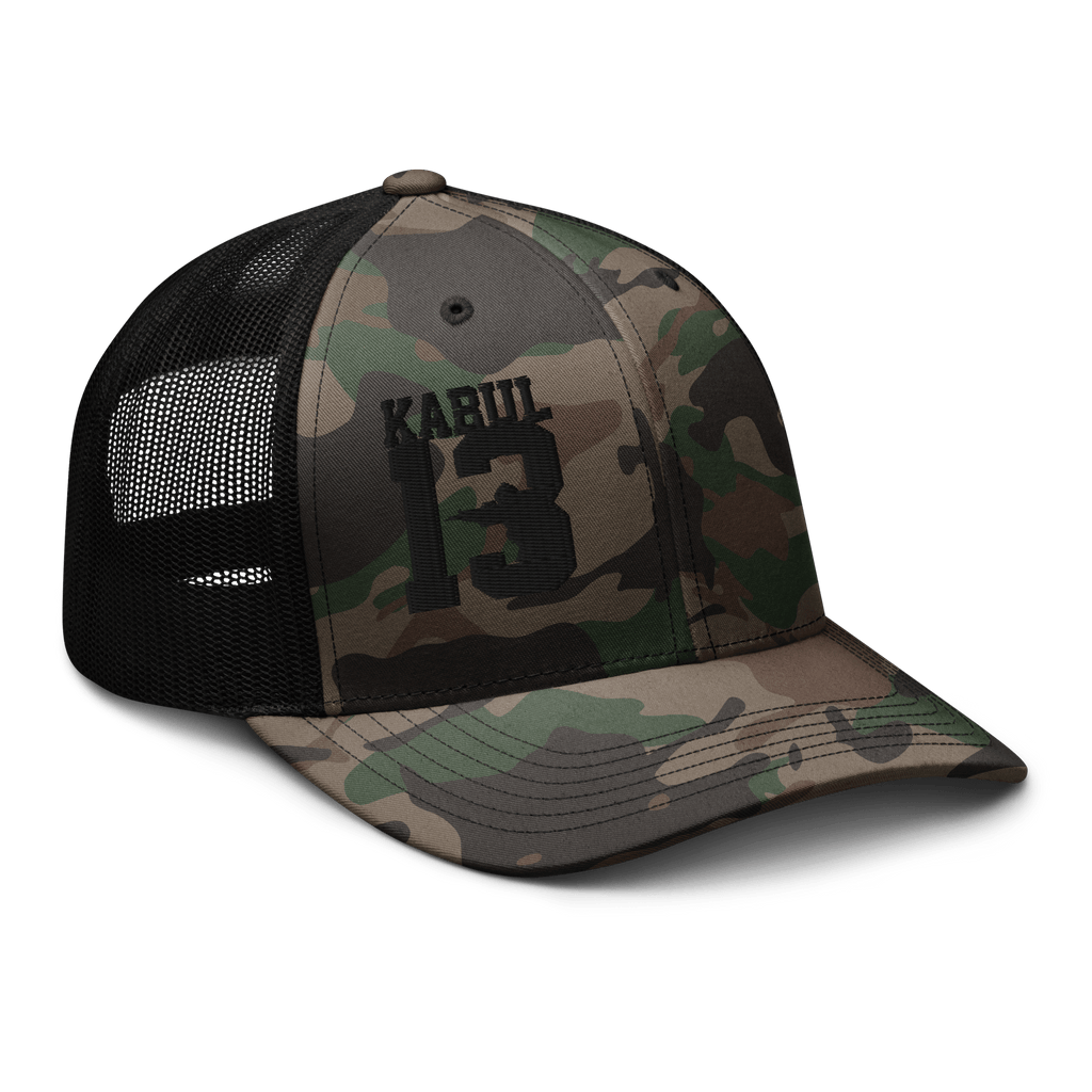 Black/Camo Abbey Gate Trucker Hat angled left showing structured crown and curved bill
