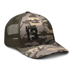 Olive/Camo Abbey Gate Trucker Hat angled left showing curved bill and crown texture