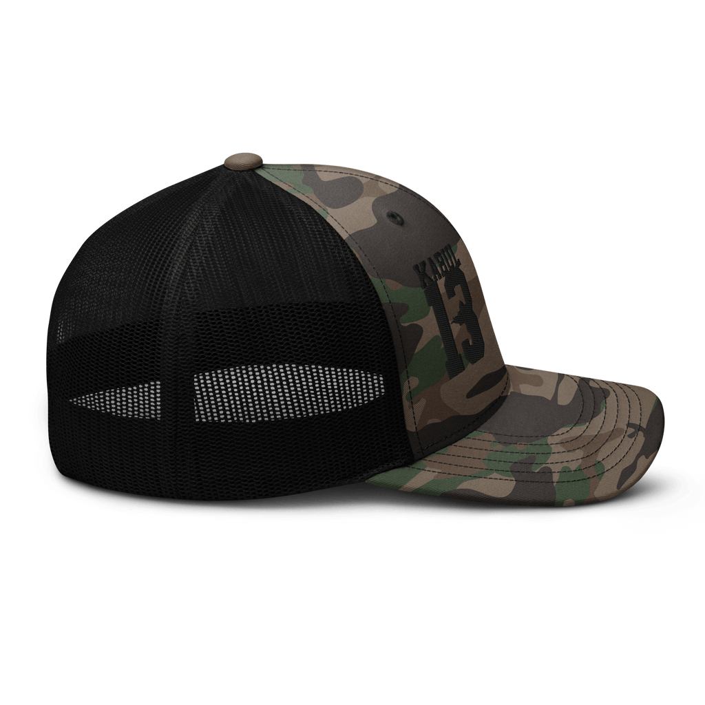 Black/Camo Abbey Gate Trucker Hat shown at a right-side profile highlighting patch embroidery and stitching