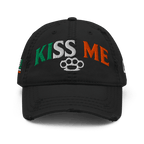 Black distressed ball cap, front view, with "KISS ME" in Irish flag colors and an Irish flag graphic on the side.