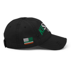 Black distressed ball cap, right-side view, with "KISS ME" text and Irish-American flag graphic on the crown.