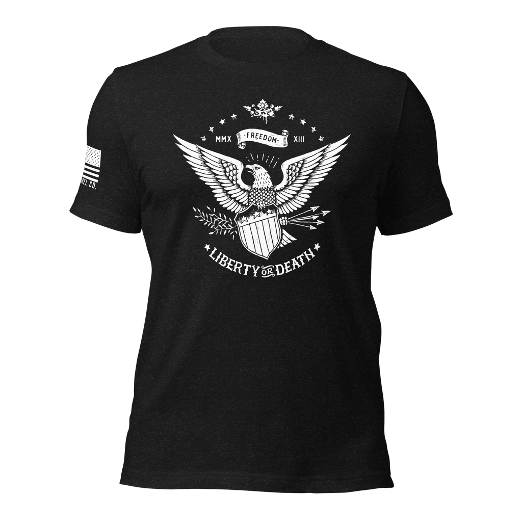 Black t-shirt with a white eagle and shield graphic with the text "LIBERTY OR DEATH" and a white American flag on the sleeve.