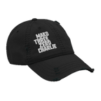 Black distressed ball cap angled right, with white "MAKO THREE ZERO CHARLIE" embroidery and a frayed brim.