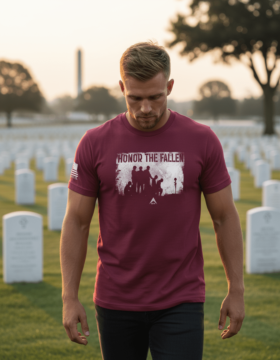 Man standing in a cemetery wearing a maroon t-shirt with "HONOR THE FALLEN" graphic and DIA logo.