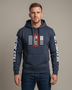 Man in studio wearing navy blue hoodie with 3 Truck flag graphic and "We're Still Heading Up" sleeve text.