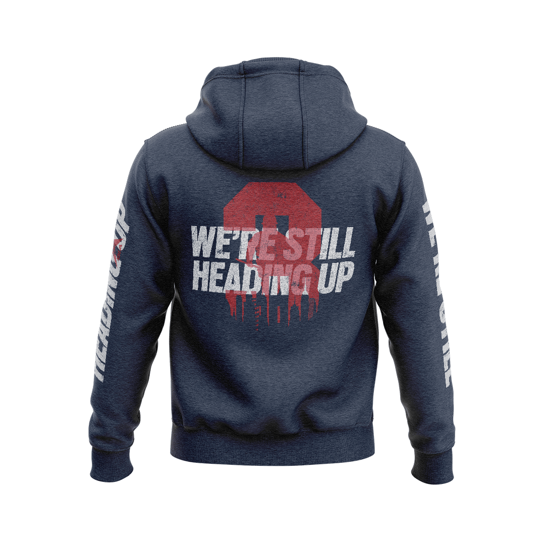 Navy hoodie back view featuring a large red "3" with white text "WE'RE STILL HEADING UP" and a city skyline.