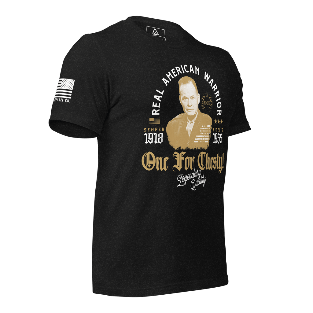 Black heather t-shirt in a three-quarter view, featuring a Chesty Puller graphic and an American flag on the sleeve.