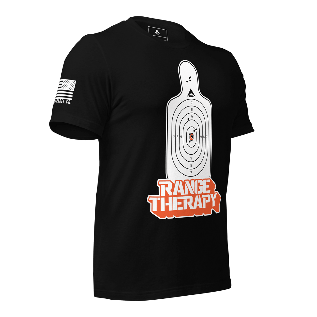 Black t-shirt angled left featuring a white silhouette target, orange "RANGE THERAPY" text, and a white American flag.