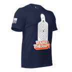 Navy blue t-shirt angled left featuring a white silhouette target, orange "RANGE THERAPY" text, and a white sleeve flag.
