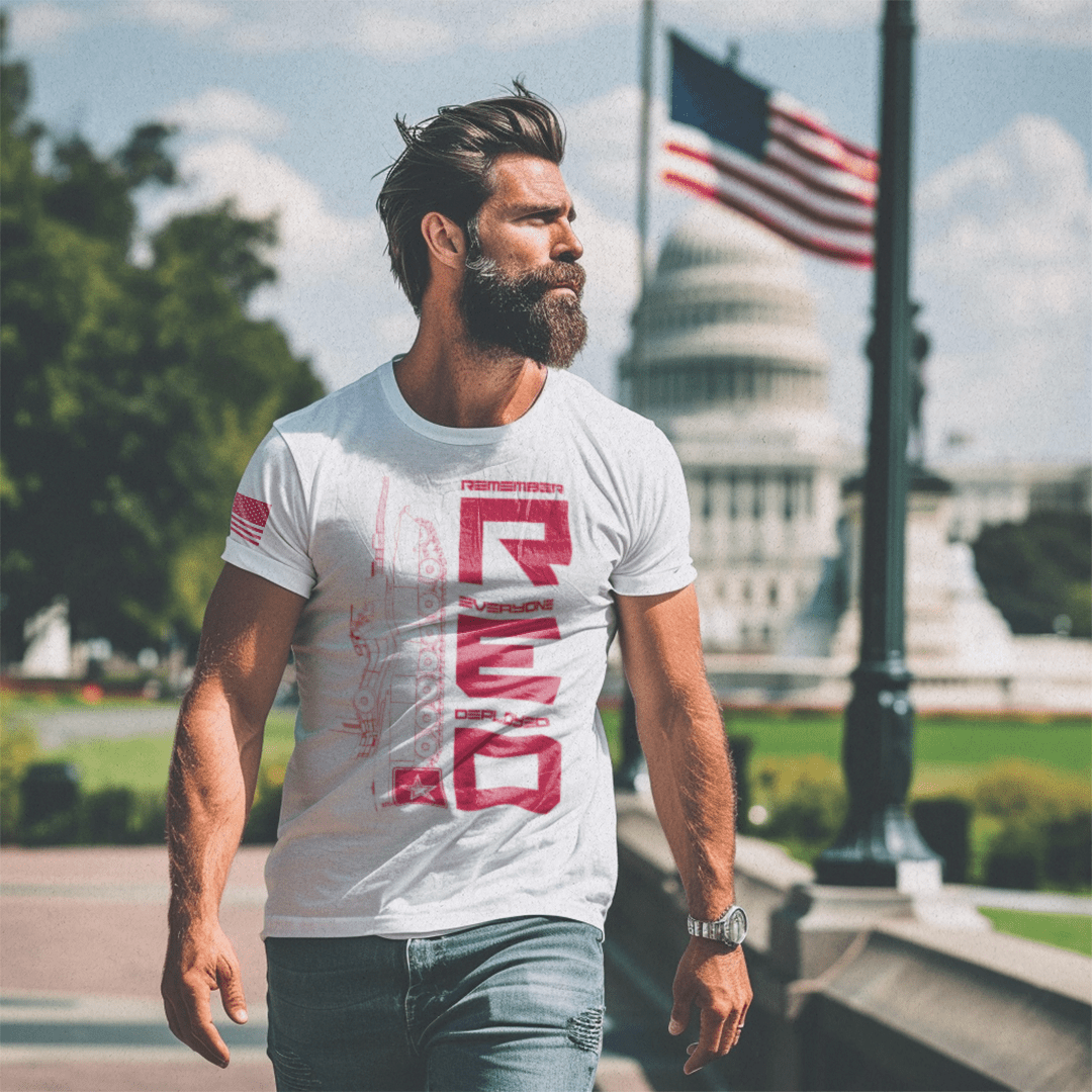 Man with a beard walks near the U.S. Capitol Building wearing a white RED Army edition DIA t-shirt.
